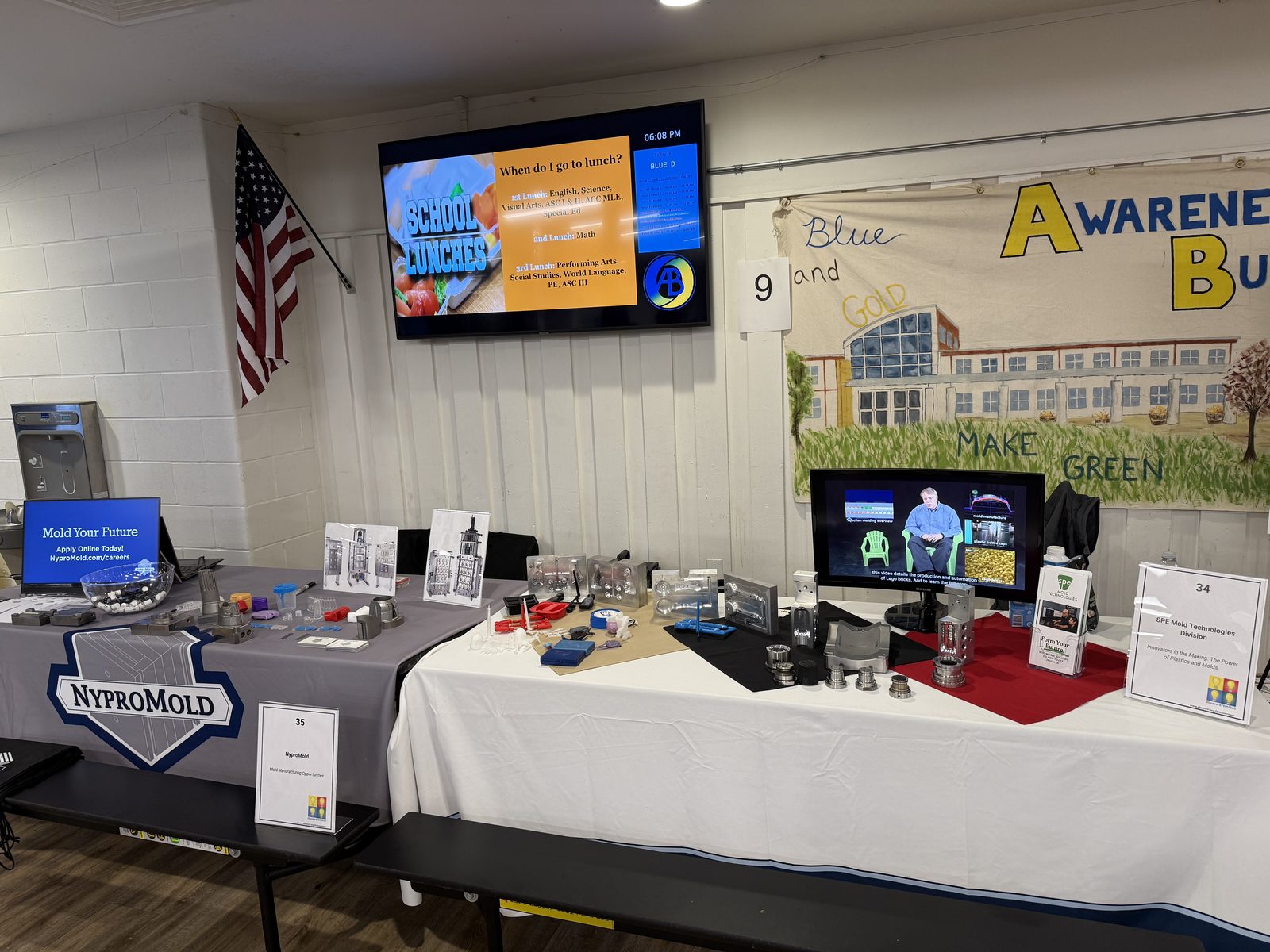 MTD and NyproMold exhibit table with mold tooling samples on display