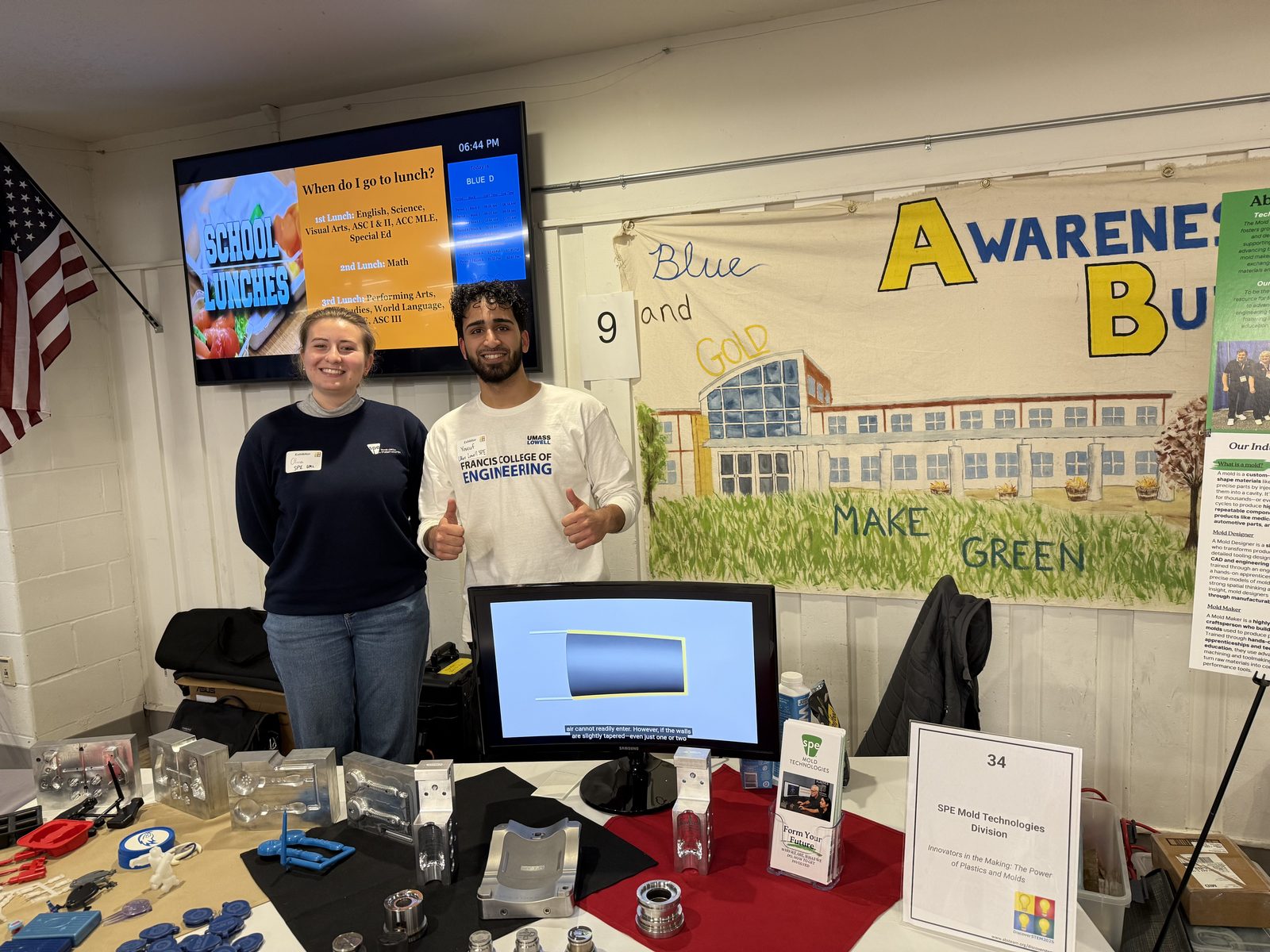 Two UMass Lowell SPE Student Chapter members at the DiscoverSTEM booth