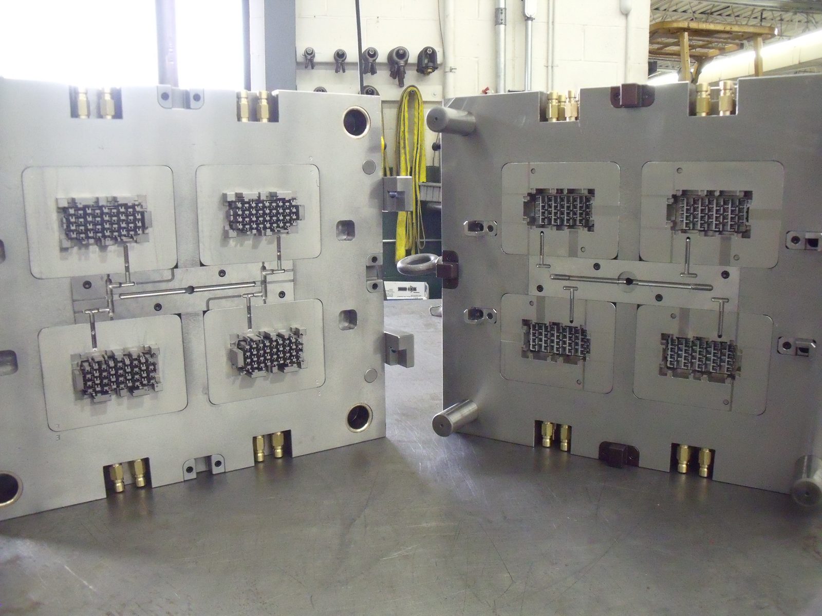 An open multi-cavity injection mold, showing both halves