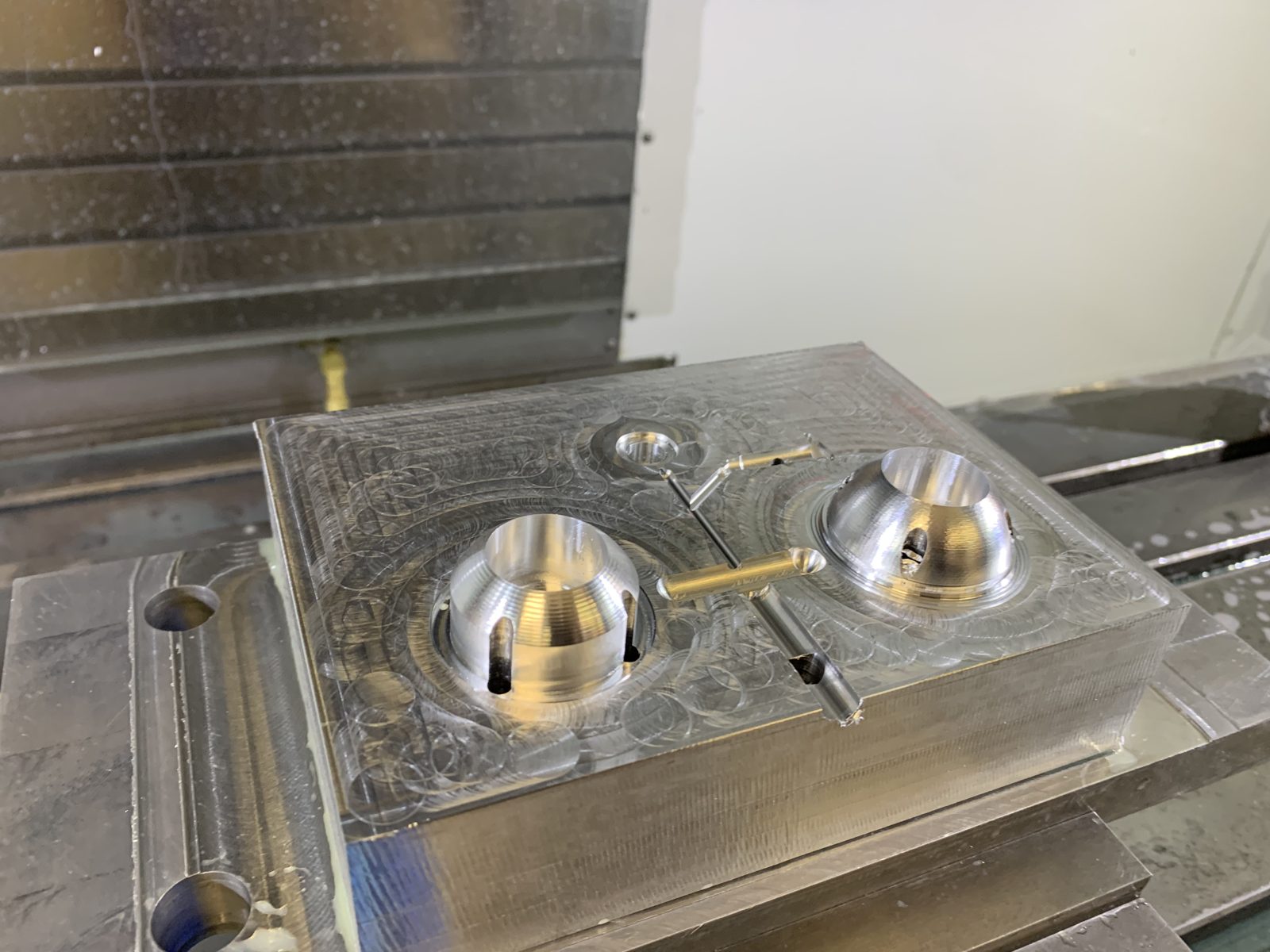 A second student-machined aluminum mold plate on a CNC milling machine